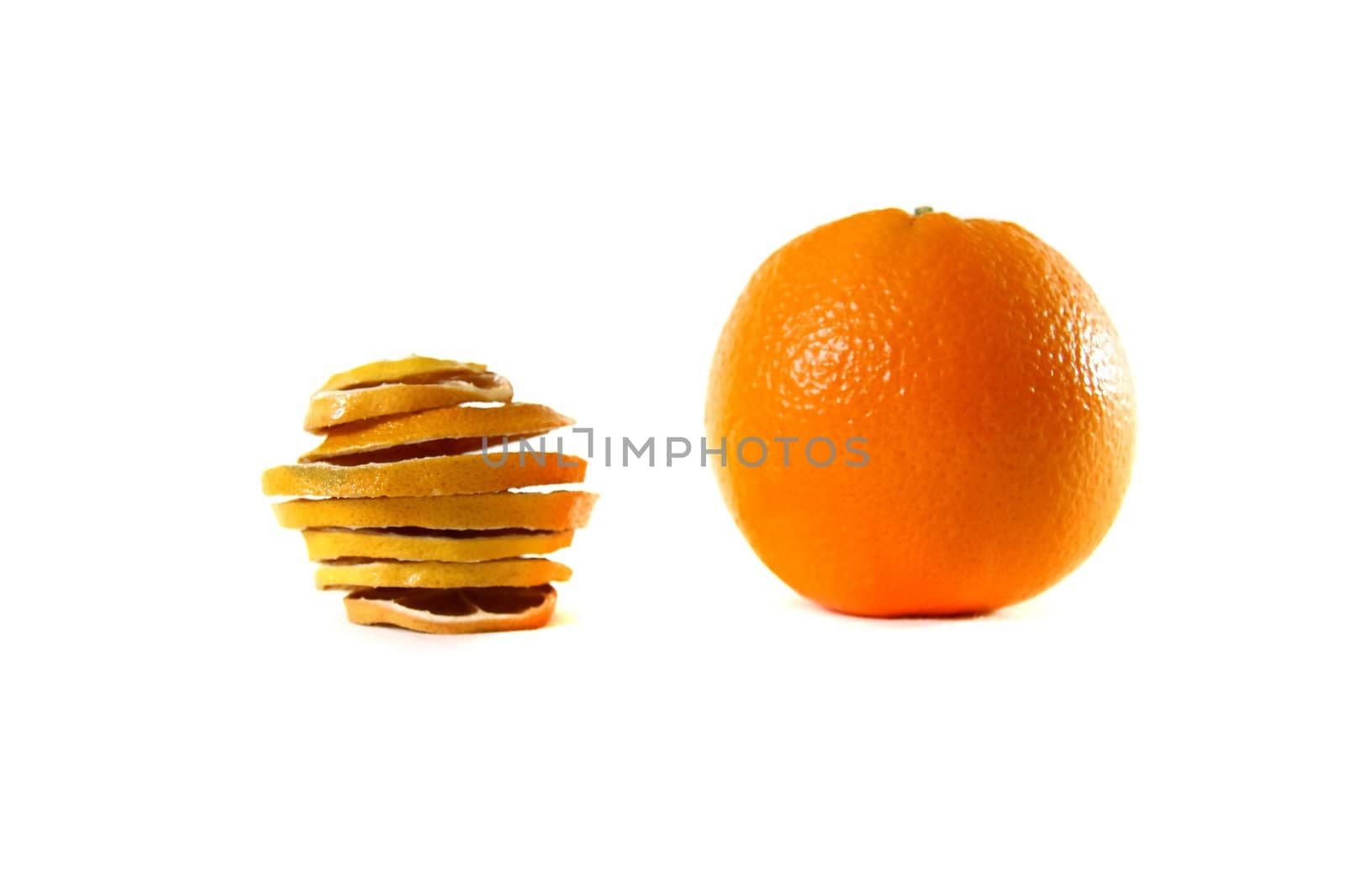 Dried sliced orange and fresh orange together on white background