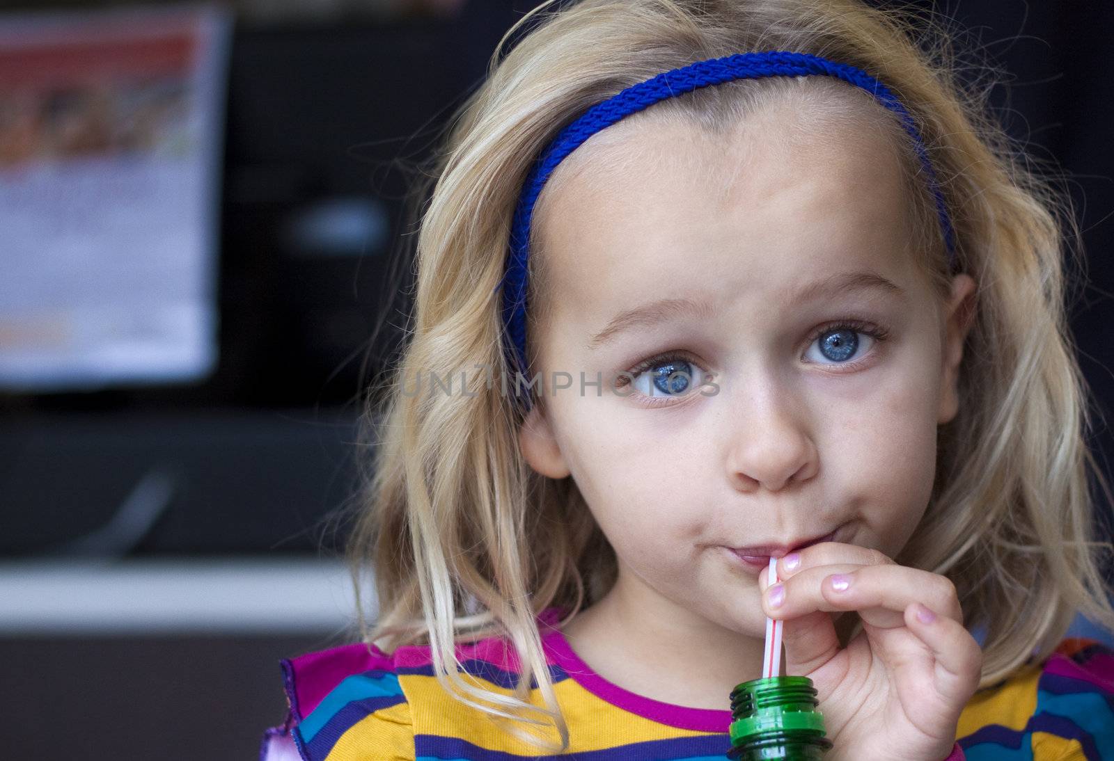 Girl drinking with straw by annems
