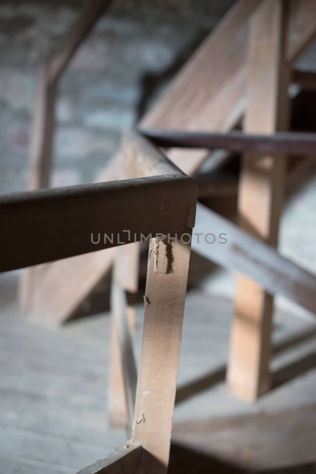 old wooden stairs in the roof of an abandoned building