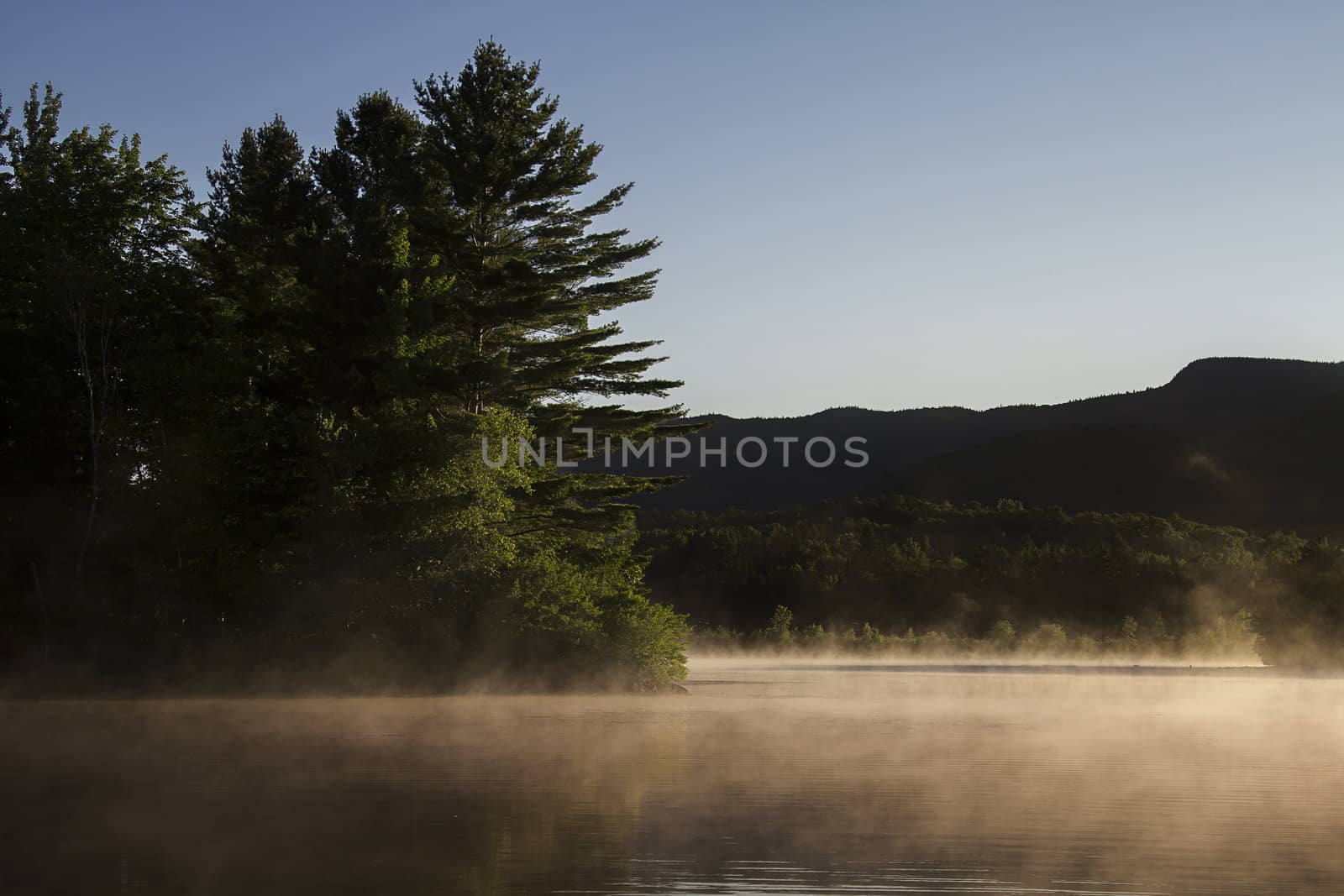 Lake covered with fog early in the morning