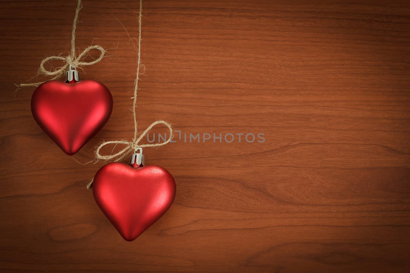 wooden board for valentine message with two red hearts