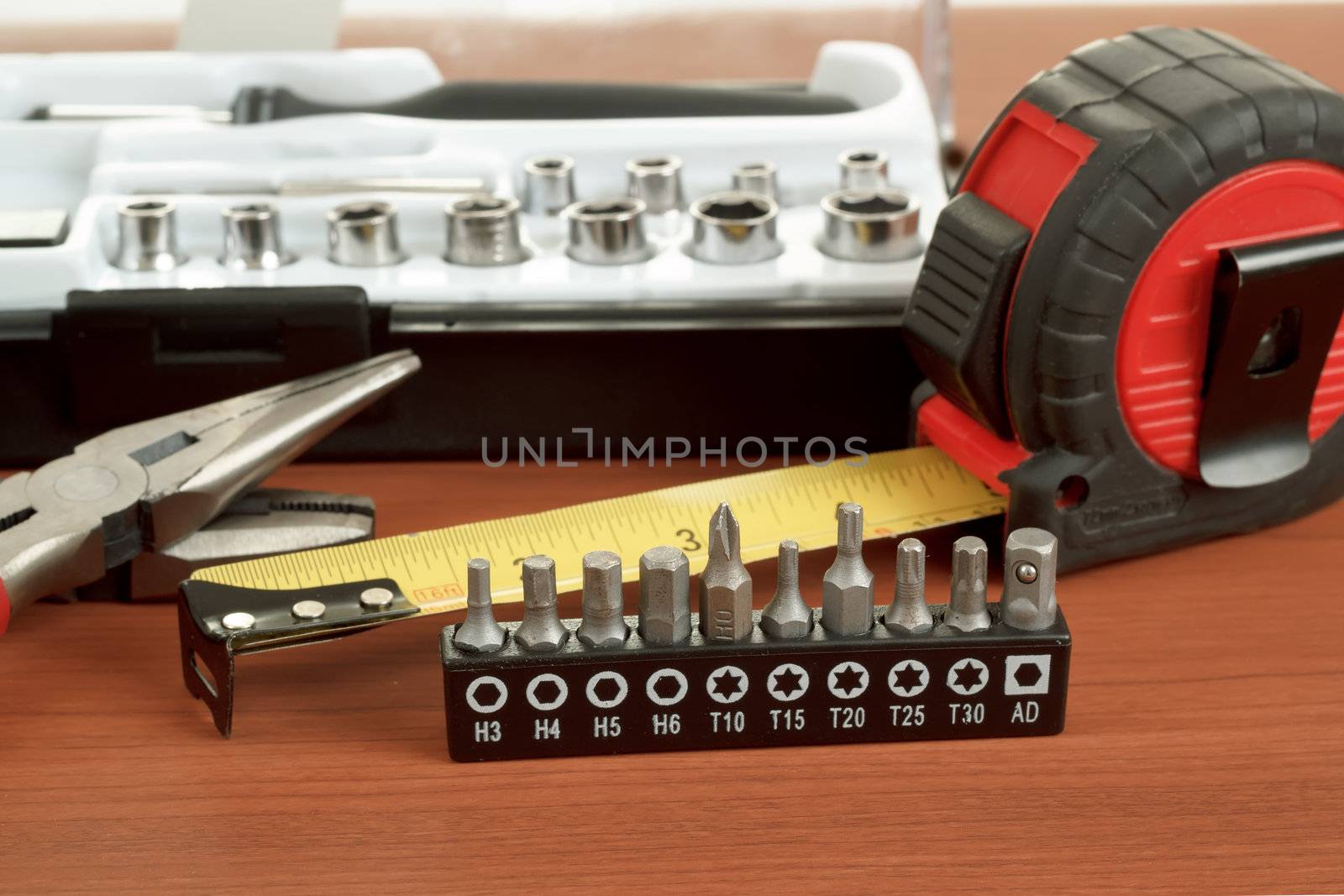 DIY work tools, screwdriver toolbox with set of bits, pliers and measuring tape