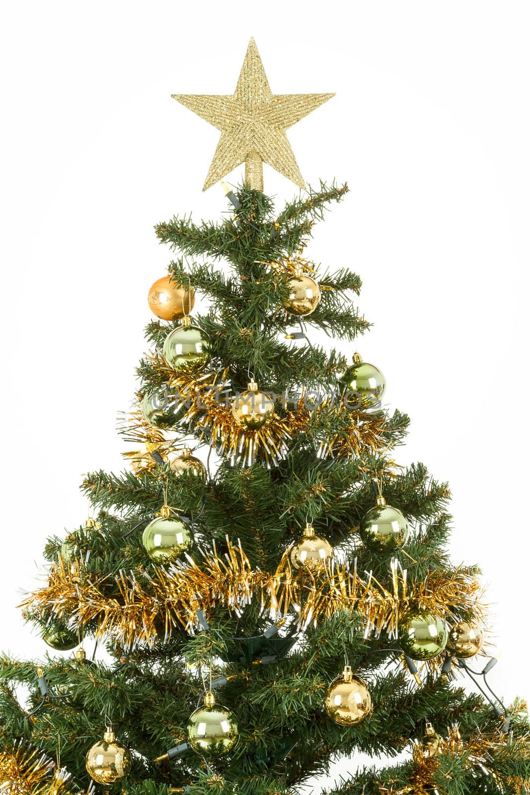 Decorated christmas tree with yellow and green balls on white background