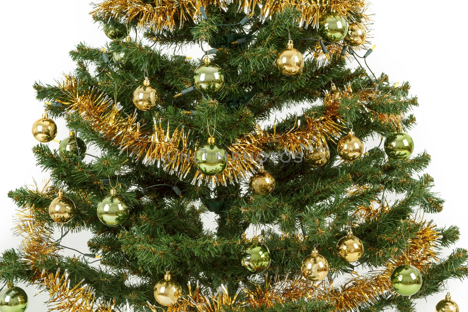 Decorated christmas tree with yellow and green balls on white background