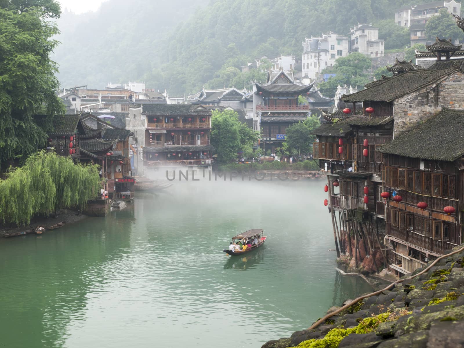 HUNAN, CHINA - JULY 7: View of Tuojiang River on July 7, 2010 in Fenghuang county, China. The ancient town of Fenghuang was added to the UNESCO World Heritage Tentative List in the Cultural category.