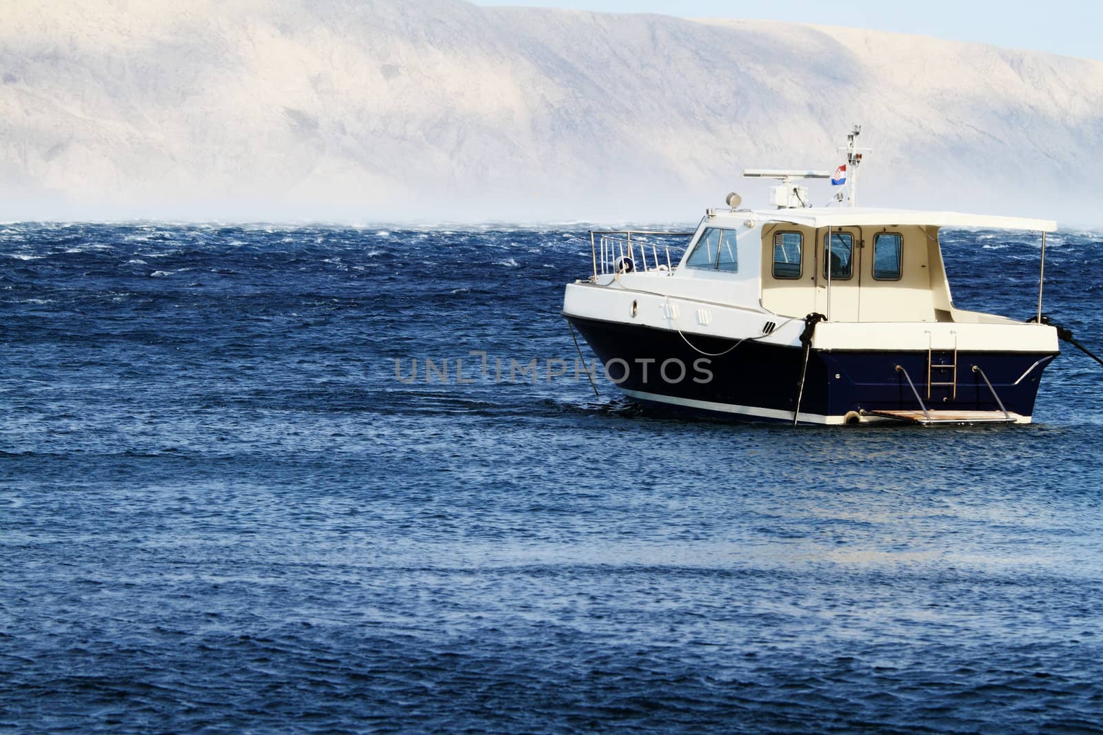 Small motorboat on the blue sea