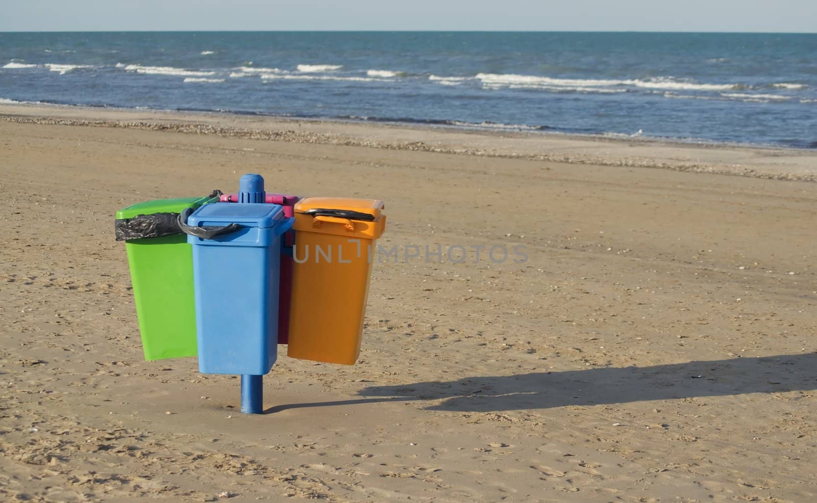 Garbage cans on the beach in Cervia in Italy