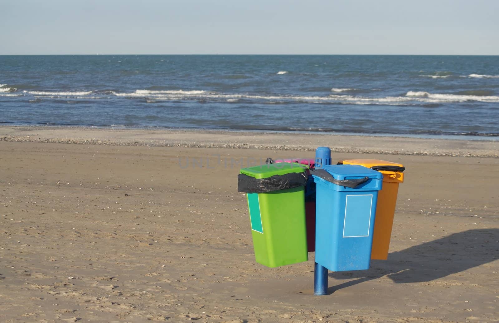 Garbage cans on the beach in Cervia in Italy