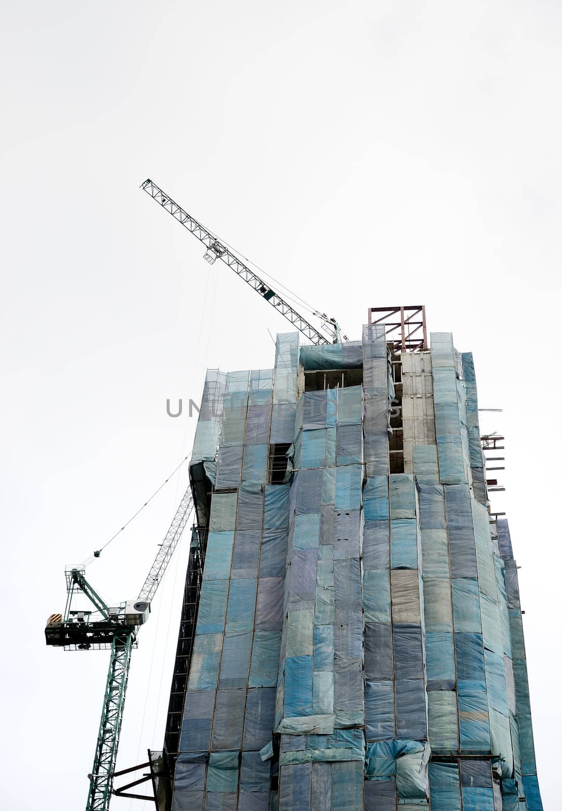 Crane work on tower, Construction site