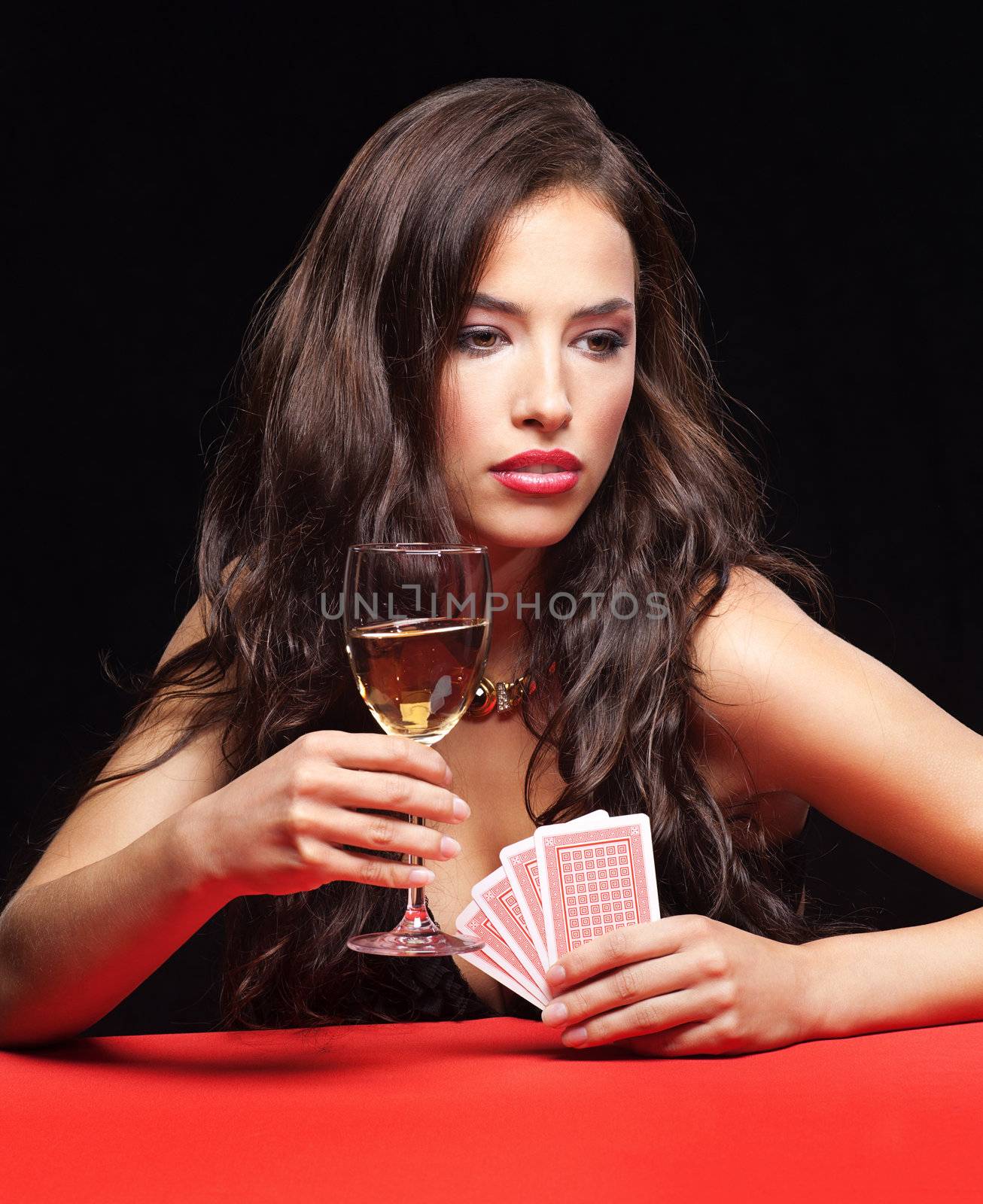 woman holding gambling cards and wine  by imarin