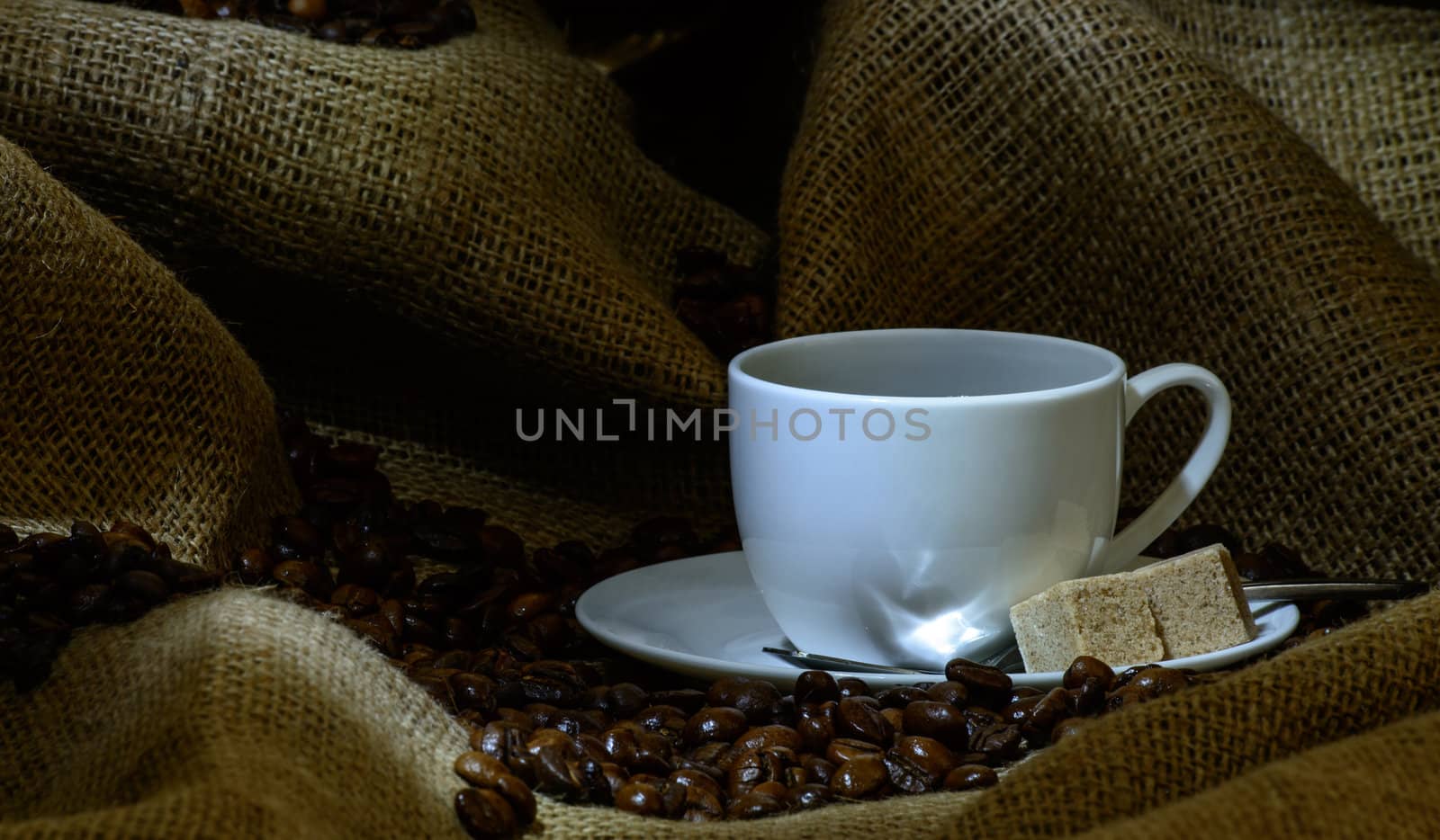 Coffee cup, beans and burlap. still life