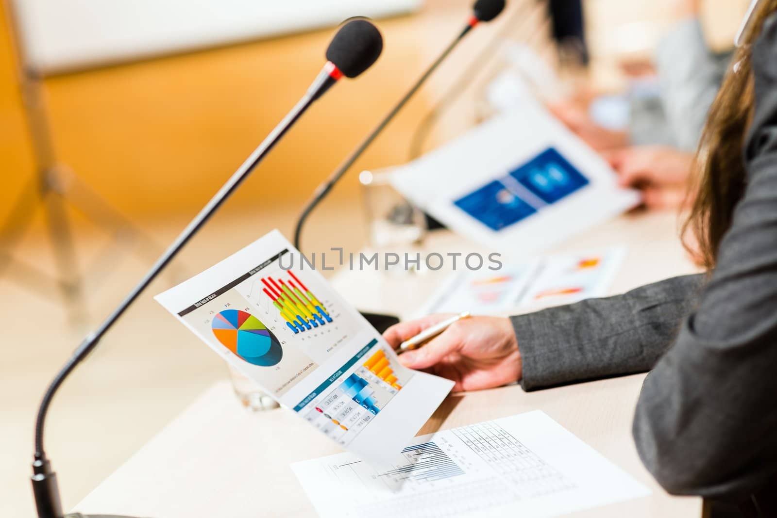 close-up microphone, on the background of business communication at the conference