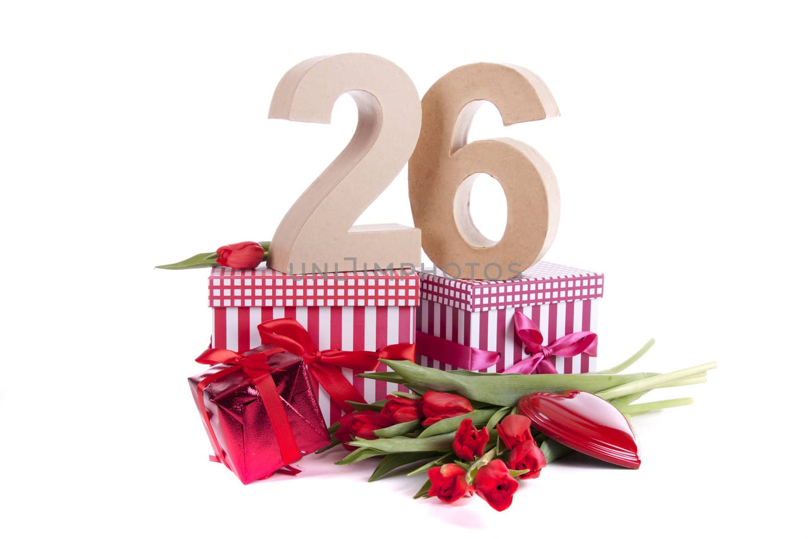 Number of age in a colorful studio setting with a red heart and gifts and tulips