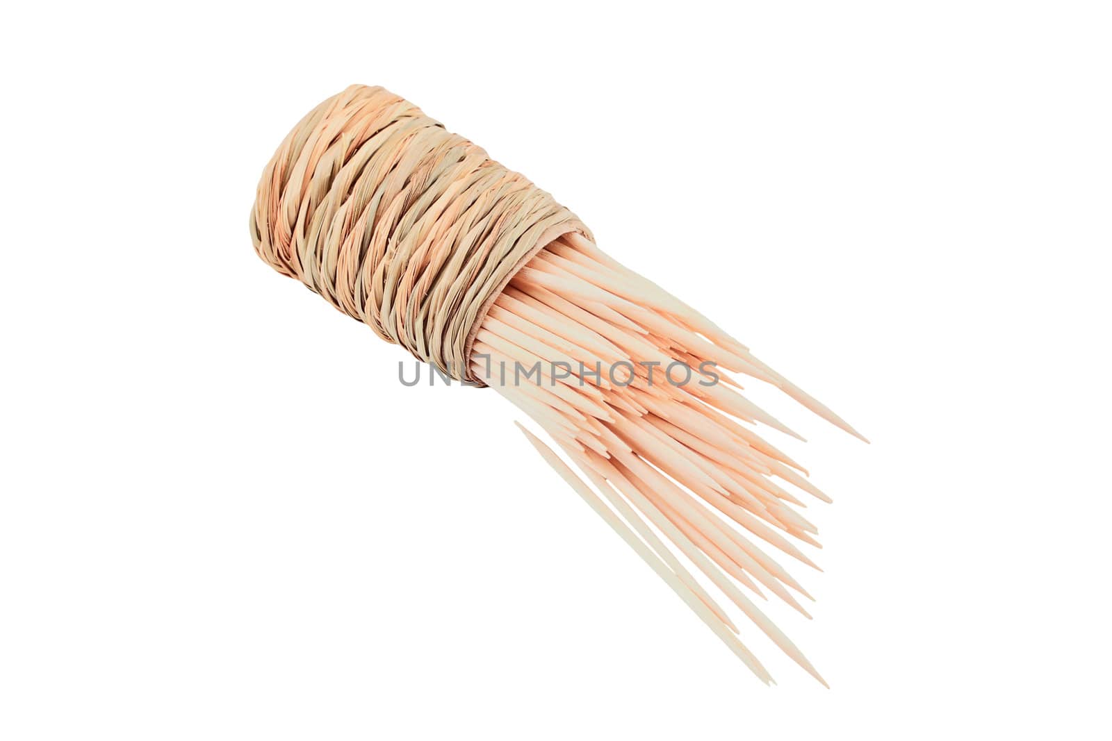 Spilled toothpicks with the holder isolated on white background