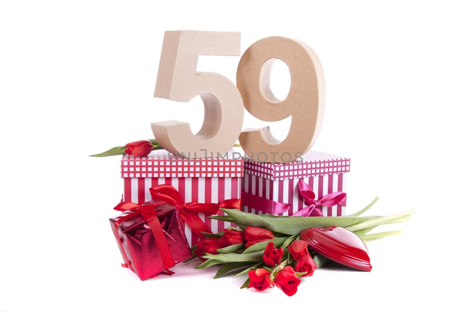 Number of age in a colorful studio setting with a red heart and gifts and tulips