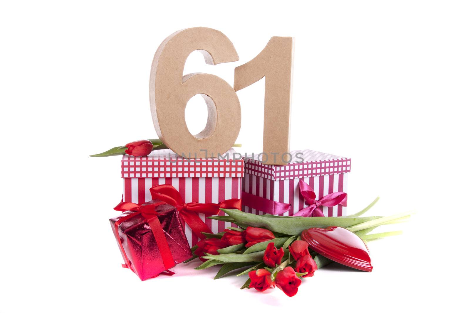 Number of age in a colorful studio setting with a red heart and gifts and tulips