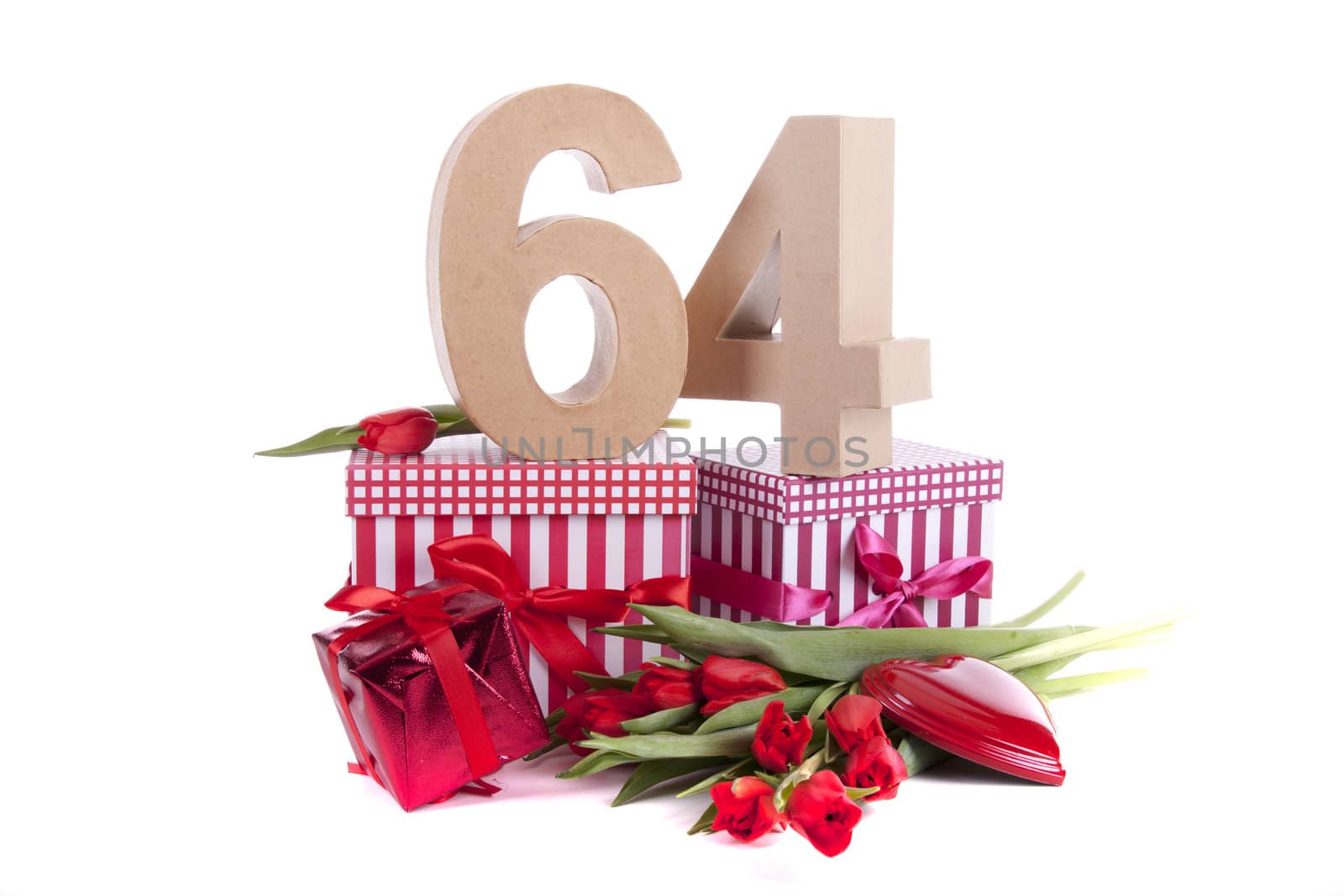 Number of age in a colorful studio setting with a red heart and gifts and tulips