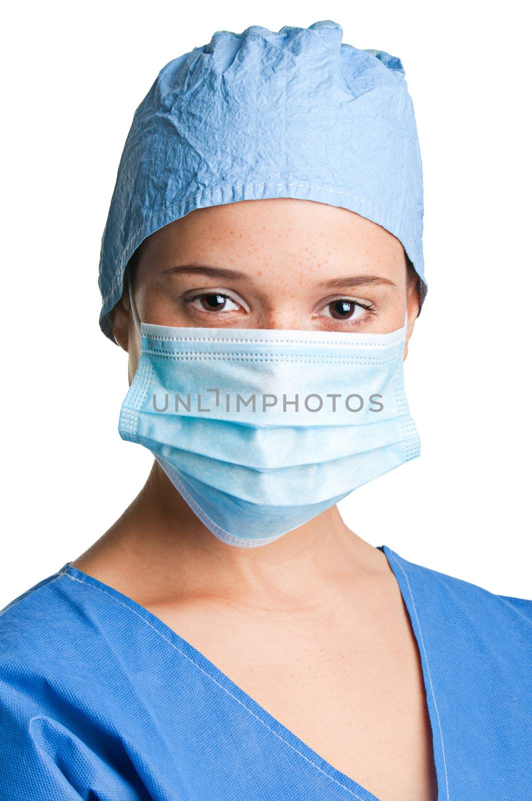 Young female surgeon with scrubs, holding a face mask on a white background