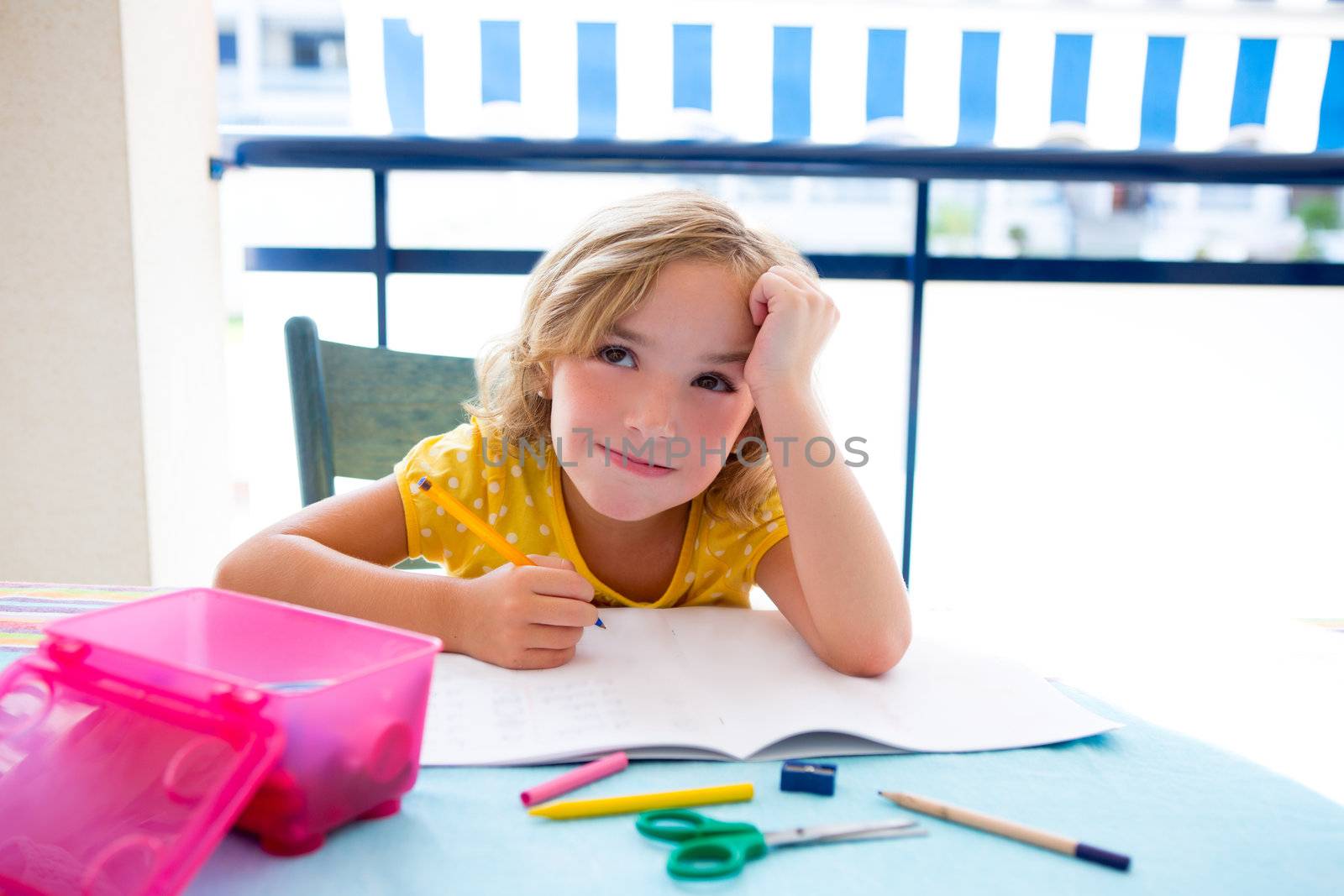 Child student kid girl bored with homework on desk by lunamarina