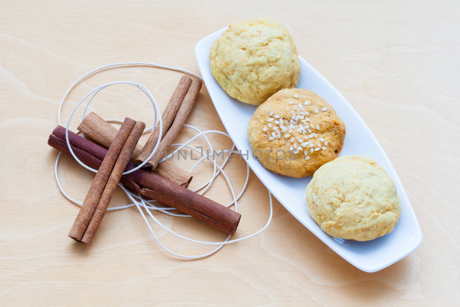 biscuits on a plate and cinnamon sticks
