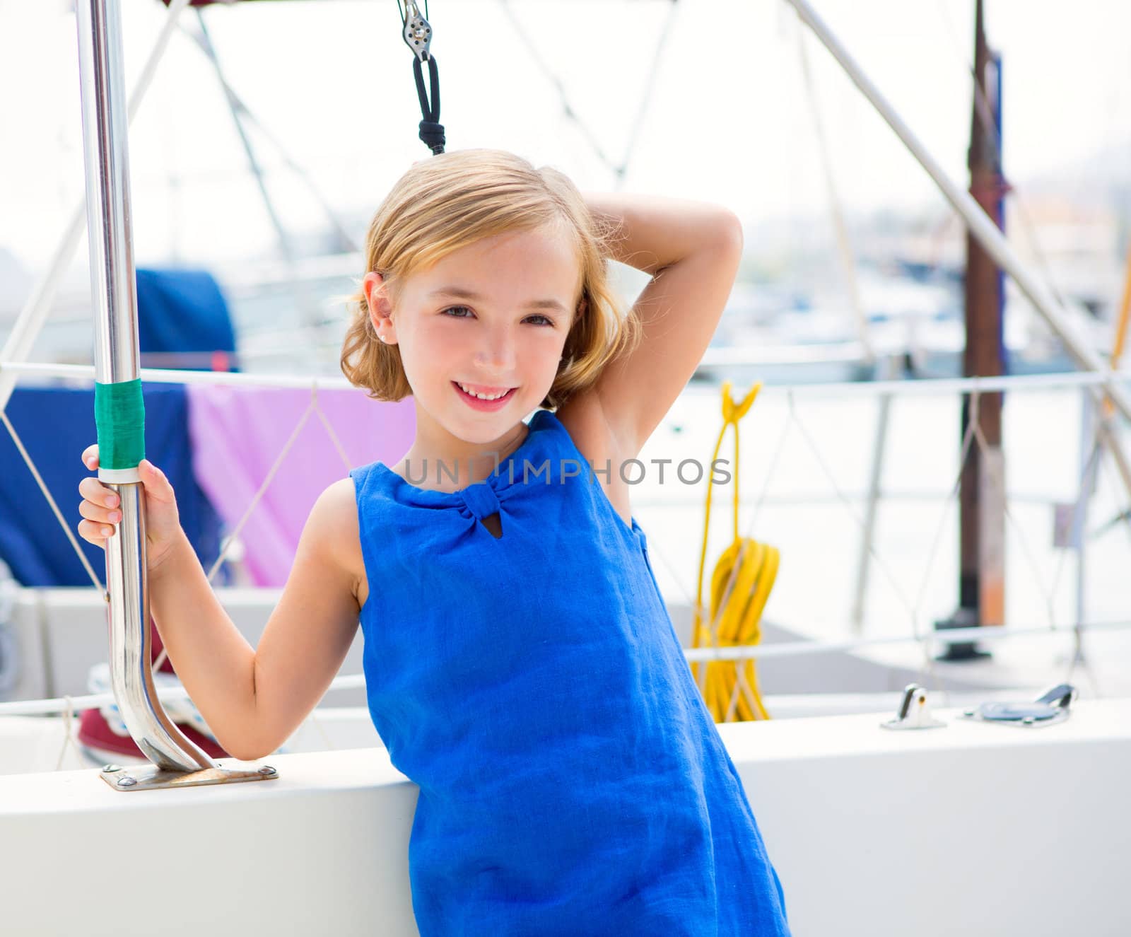 child kid girl in marina boat on summer vacations in Mediterranean