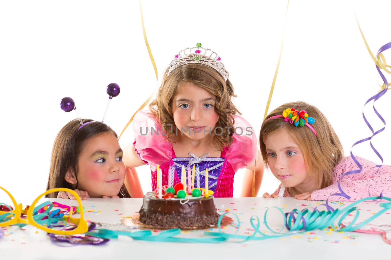 children kid girls birthday party looking excited chocolate candles cake