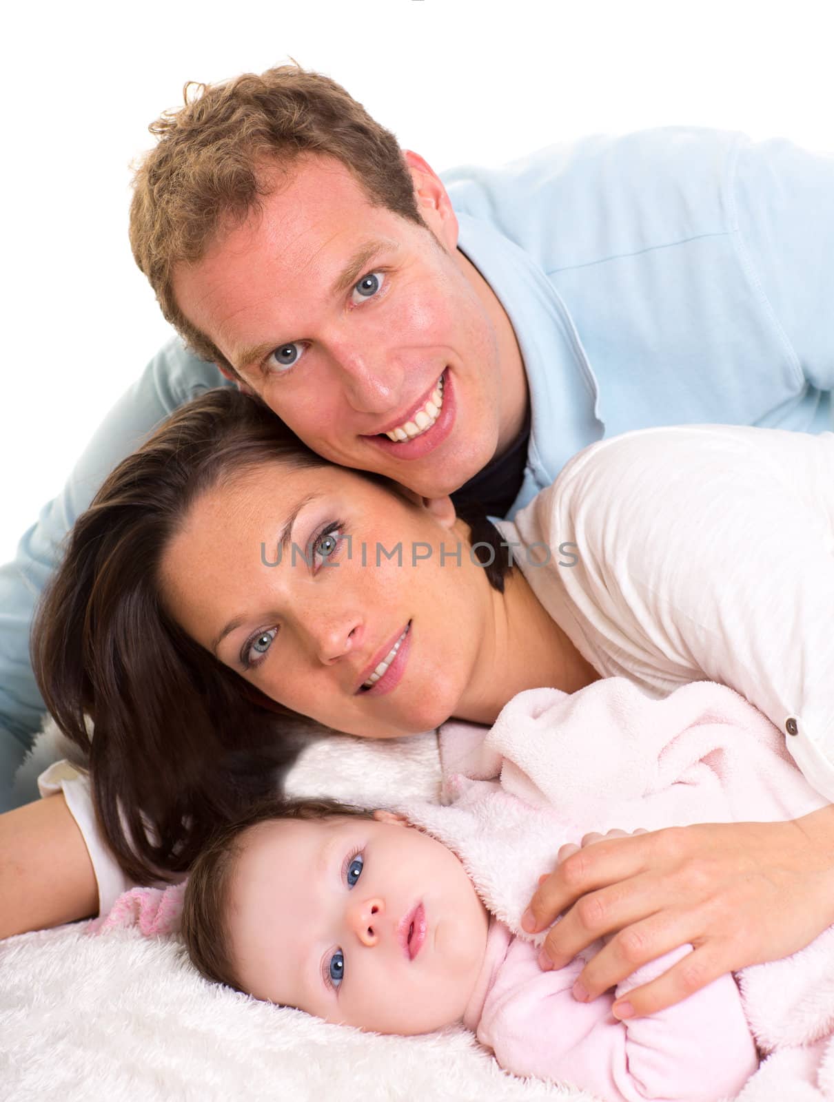 Baby girl mother and father family happy lying together by lunamarina
