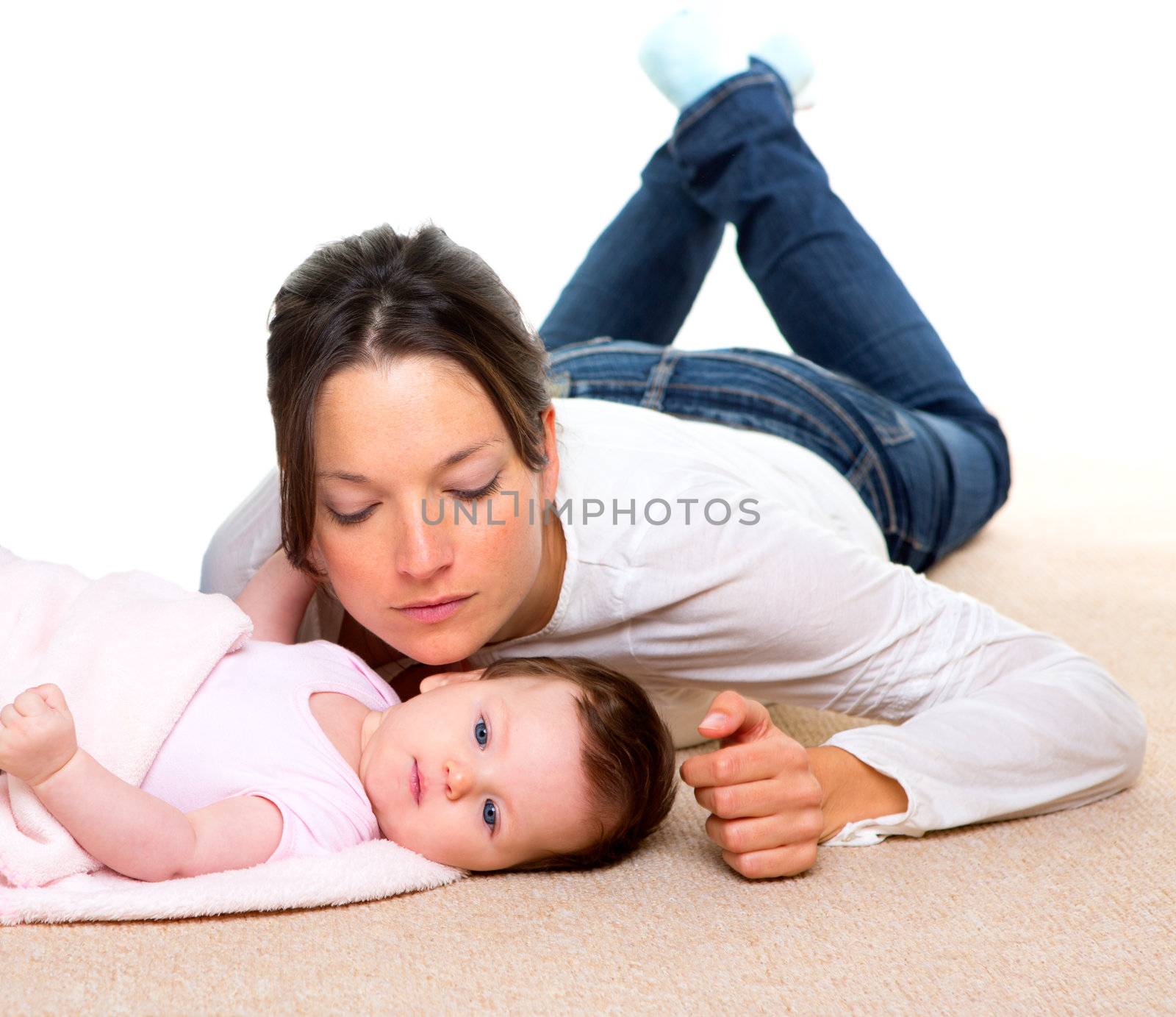 Baby and mother lying on beige carpet together and white background