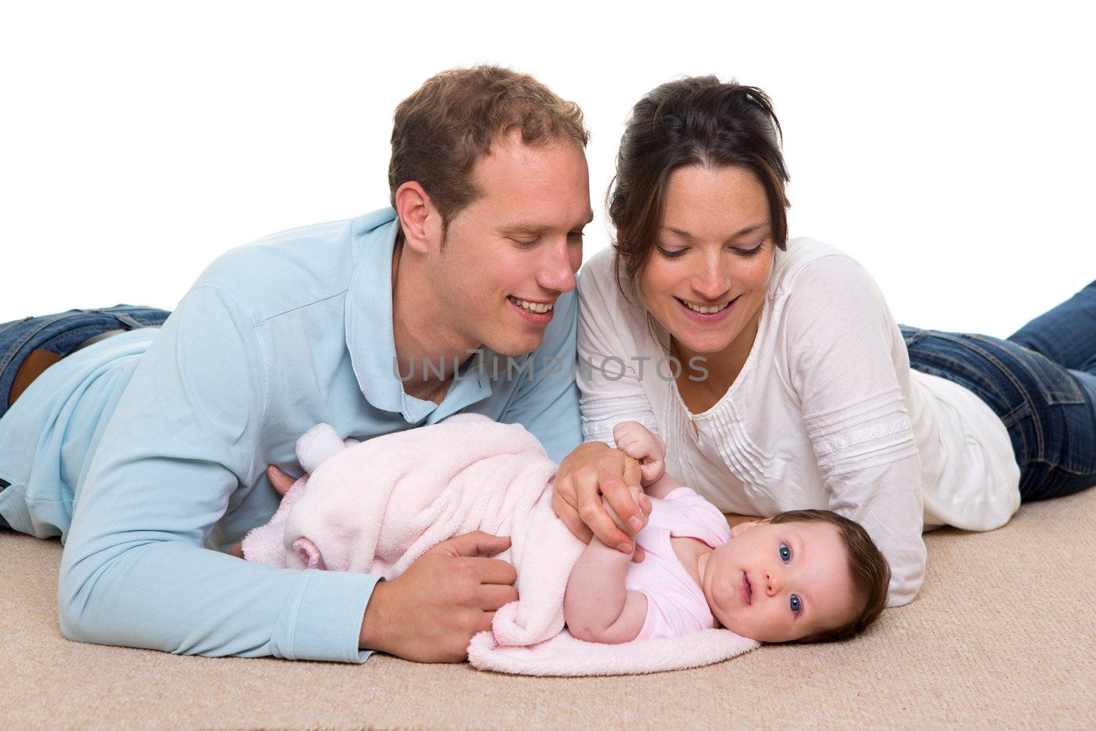 Baby mother and father happy family portrait lying on carpet and white background