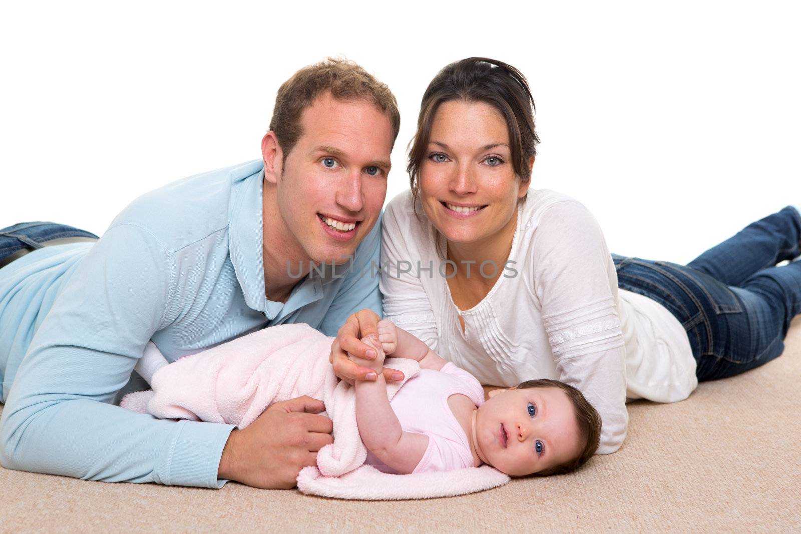 Baby mother and father happy family portrait lying on carpet and white background