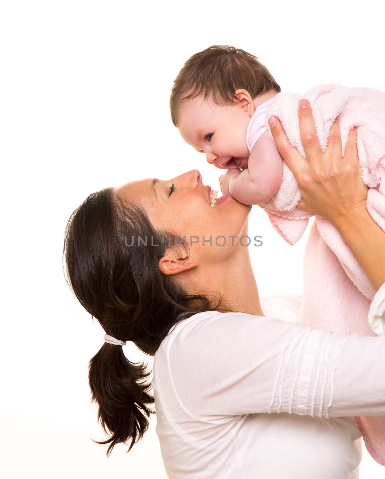 Baby girl hug in mother arms playingin happy on white by lunamarina