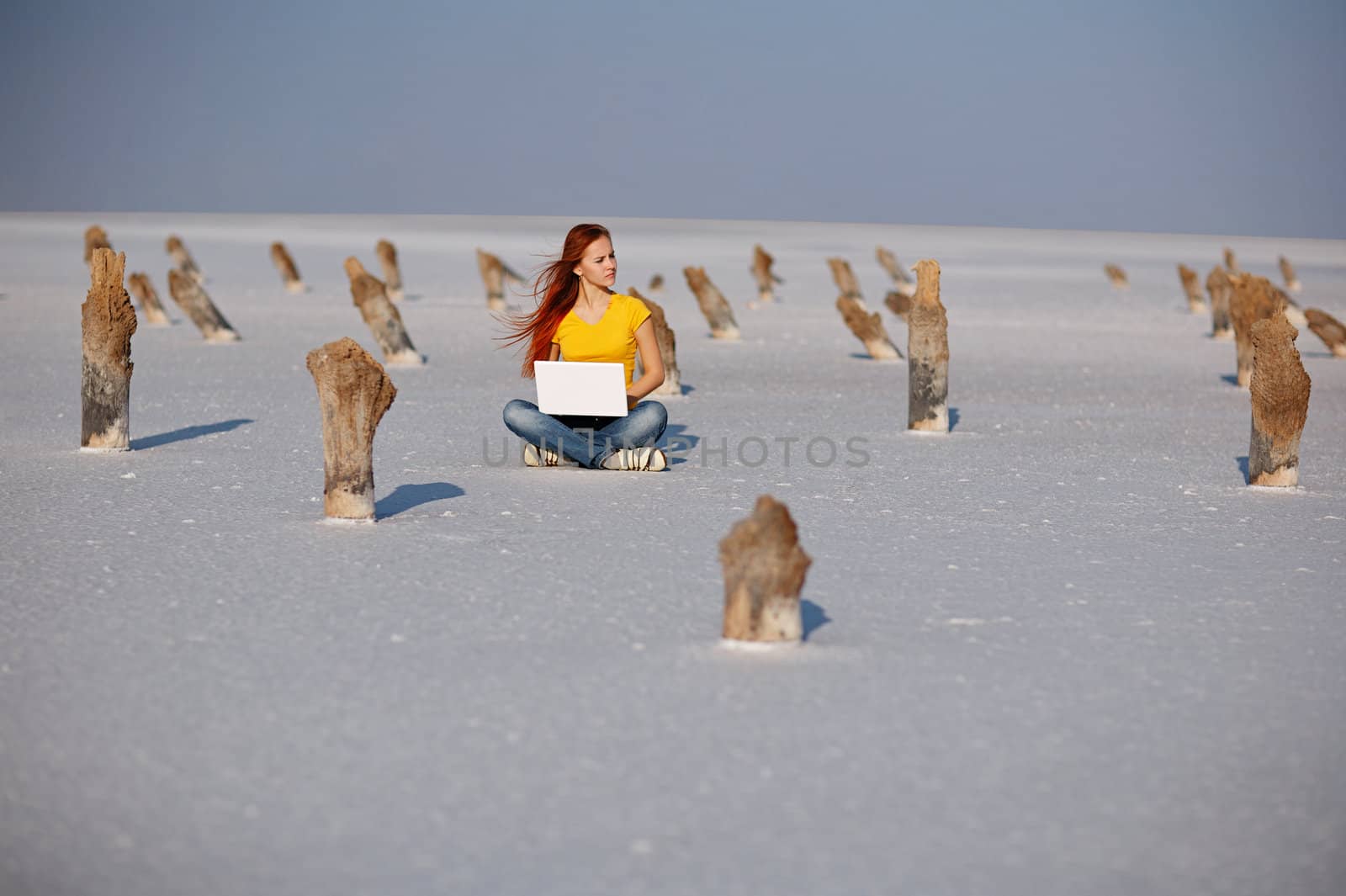 girl with notebook on the salt sand