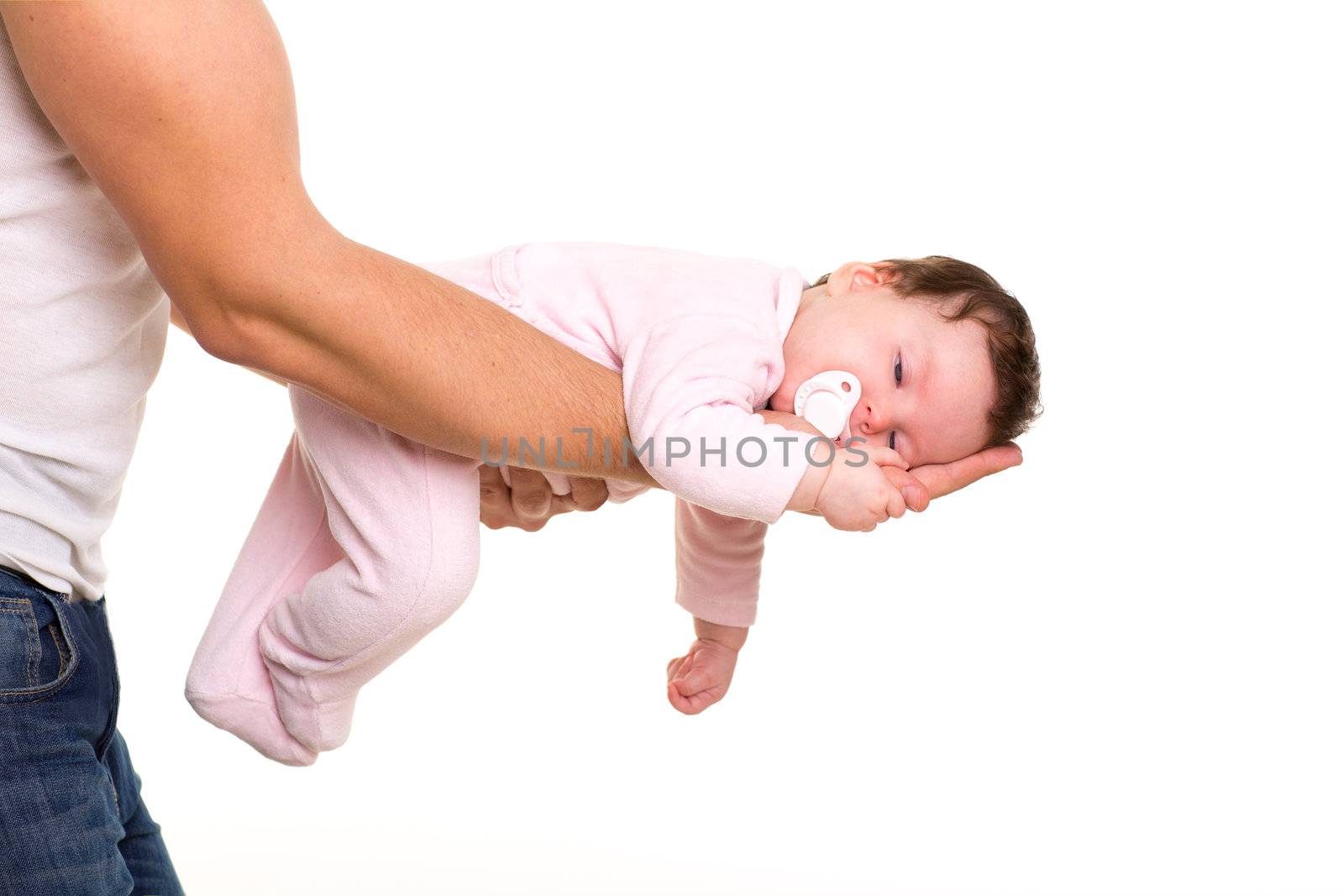 almost sleeping baby girl in father arms on white background