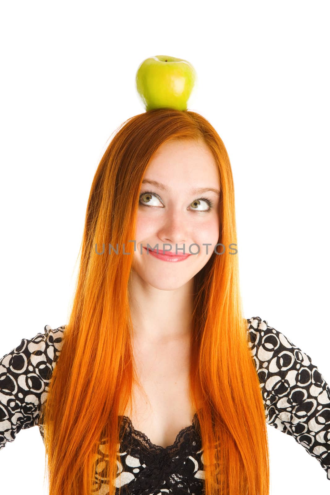 red haired girl with an apple on the head