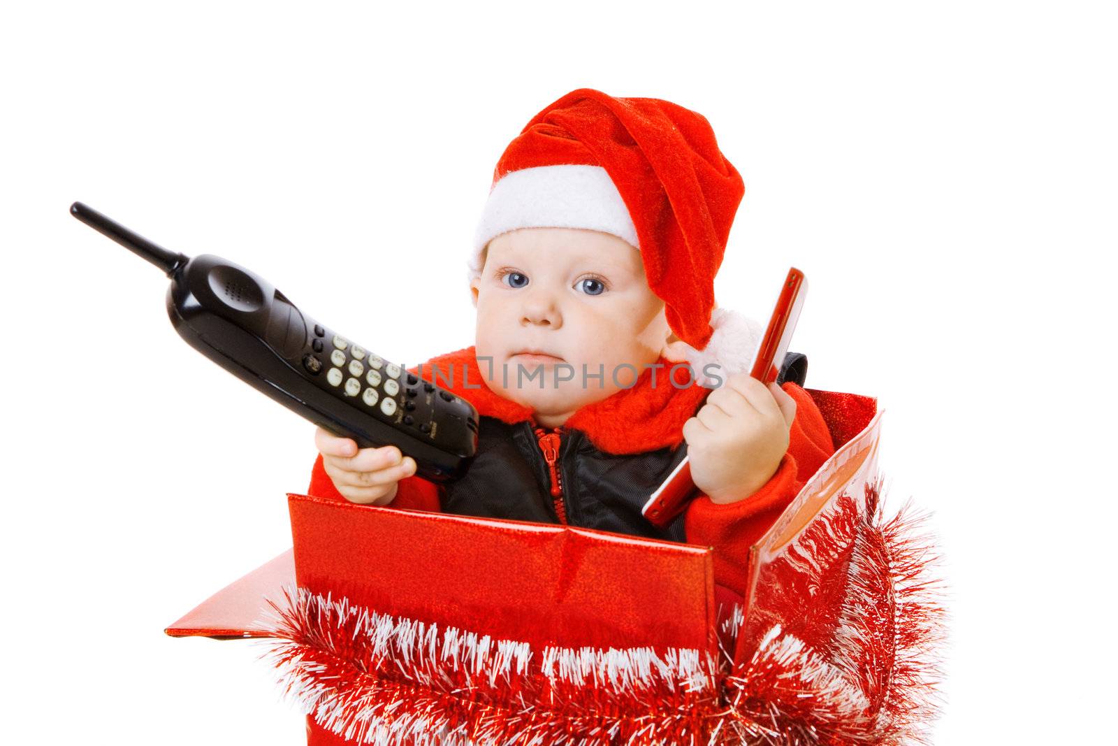 infant calling by phone in the decorated christmas box