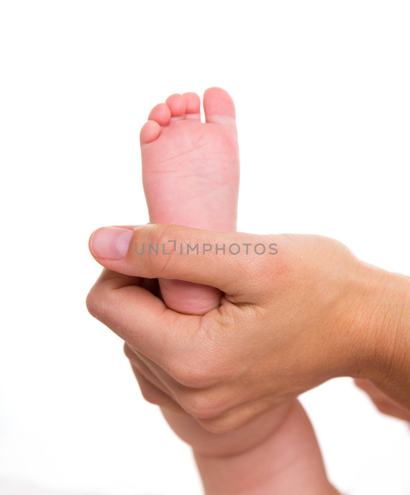 Mother hands holding baby nude feet on white by lunamarina