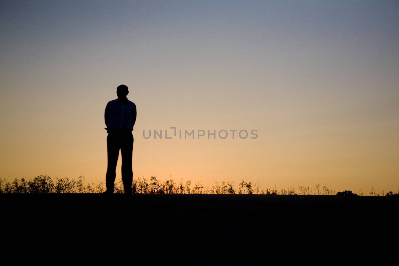 Silhouette of the man in the sunset