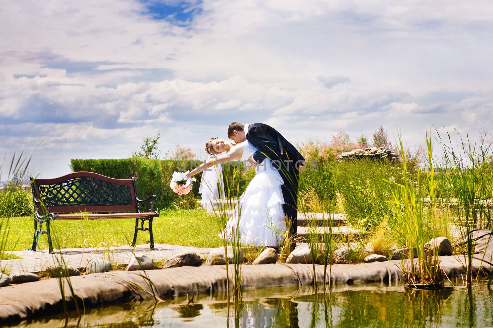 kiss of bride and groom by vsurkov