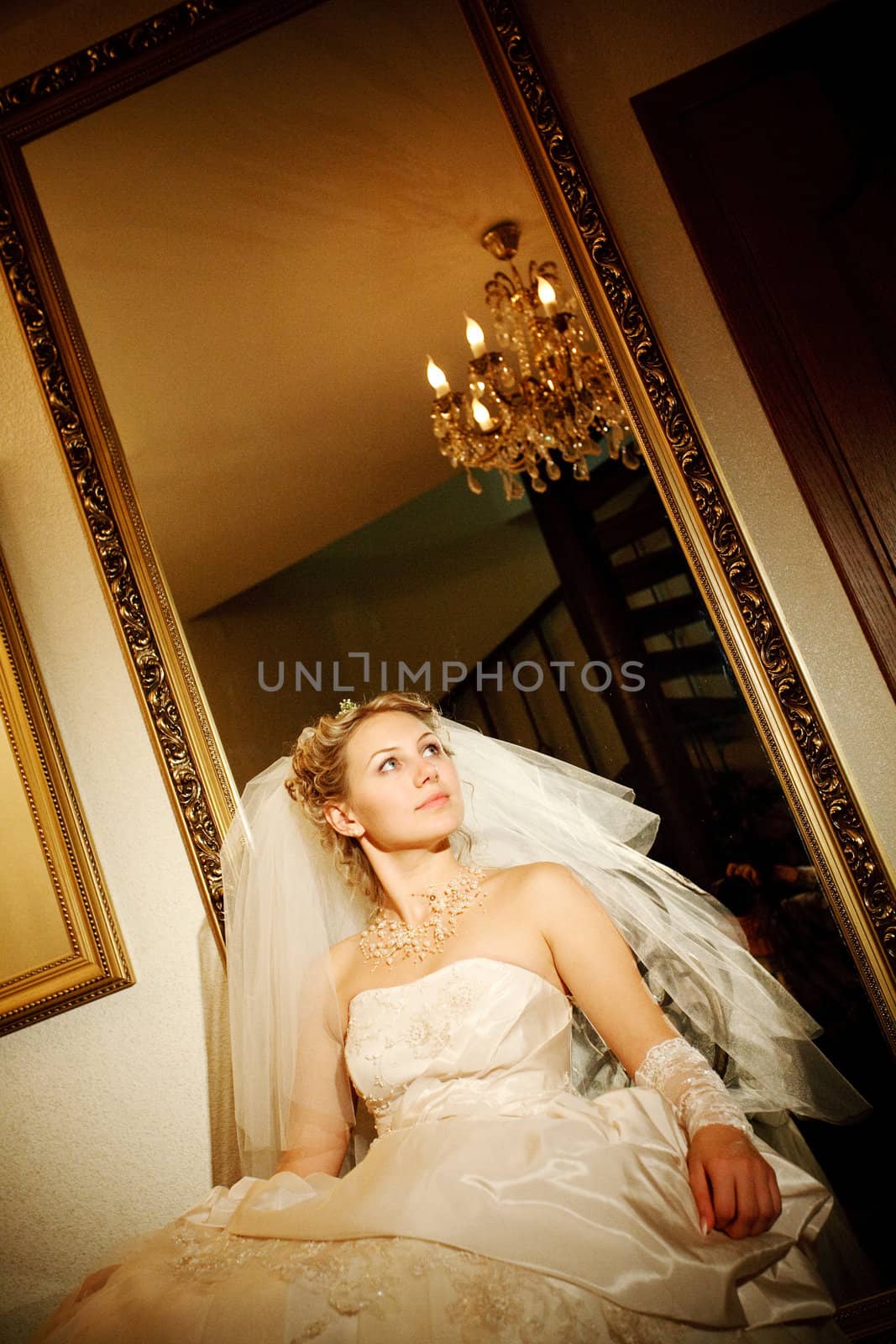 bride near the mirror at darkness