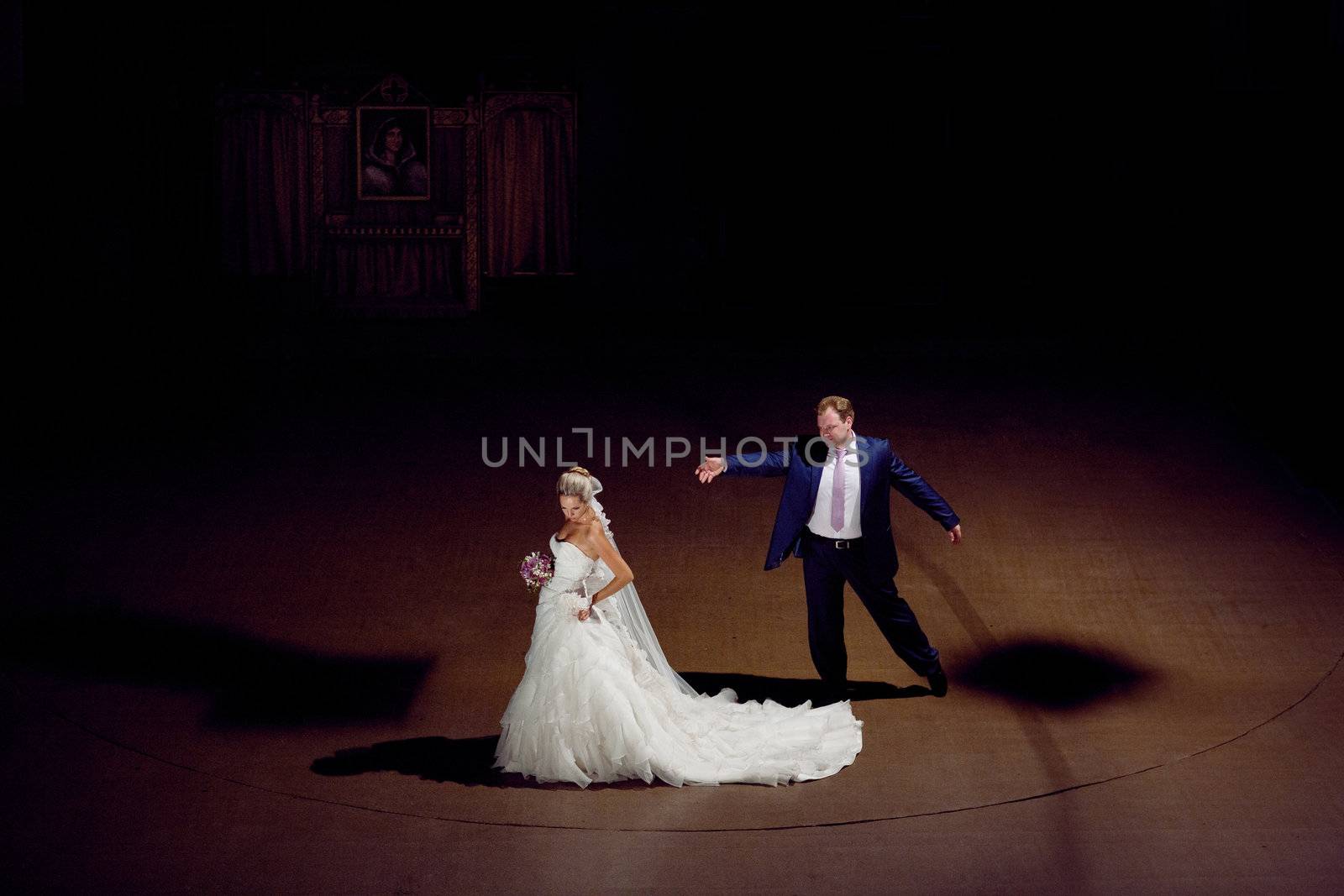 bride and groom on the stage by vsurkov