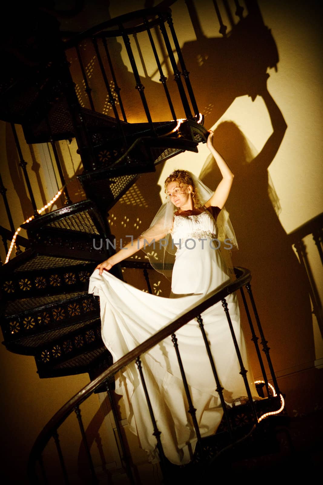 bride posing on the staircase