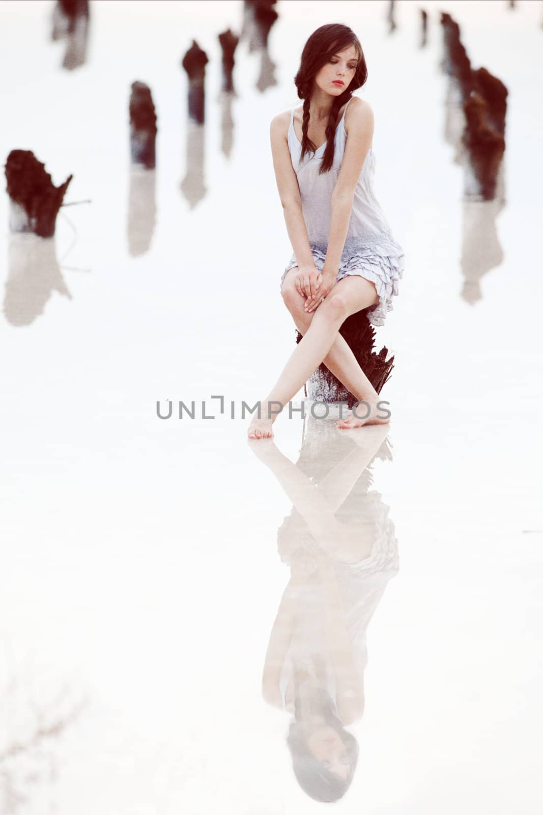 sitting girl in a salt lake