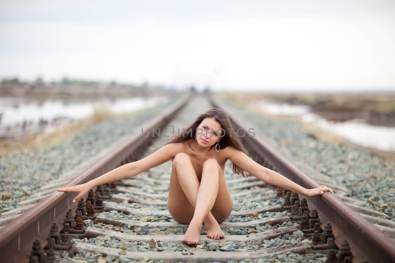 siting girl on the railway