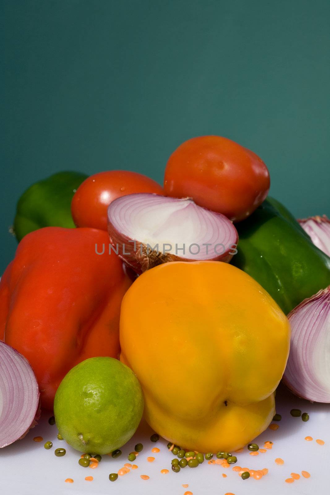 fresh vegetables on  table after market  against green wall