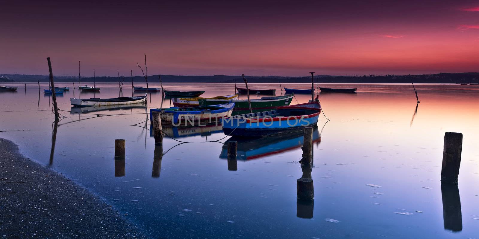 Beautiful landscape of a river and boats at sunset