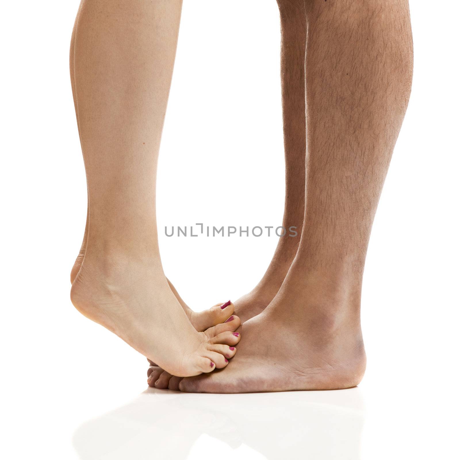 Man and woman legs isolated on a white background