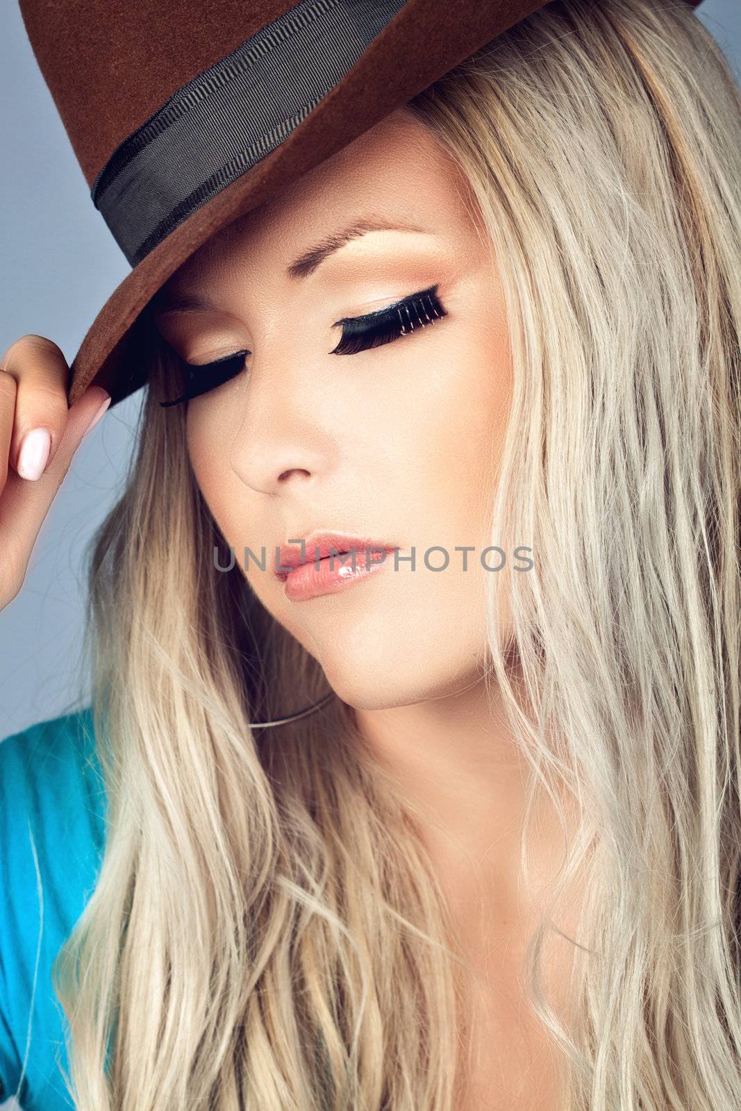 Portrait of a girl wearing a hat and have her eyes closed 