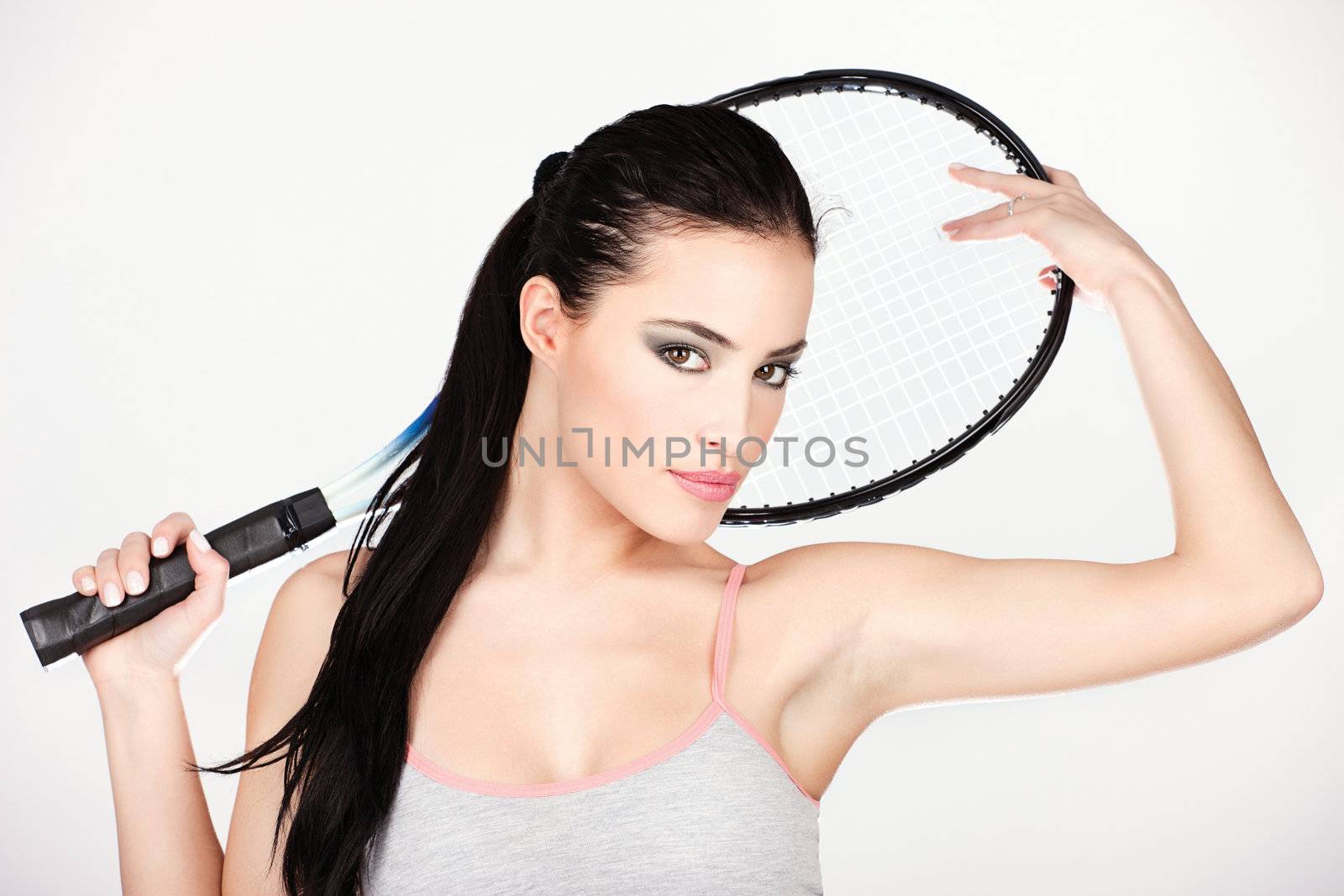 Pretty woman with tennis racket