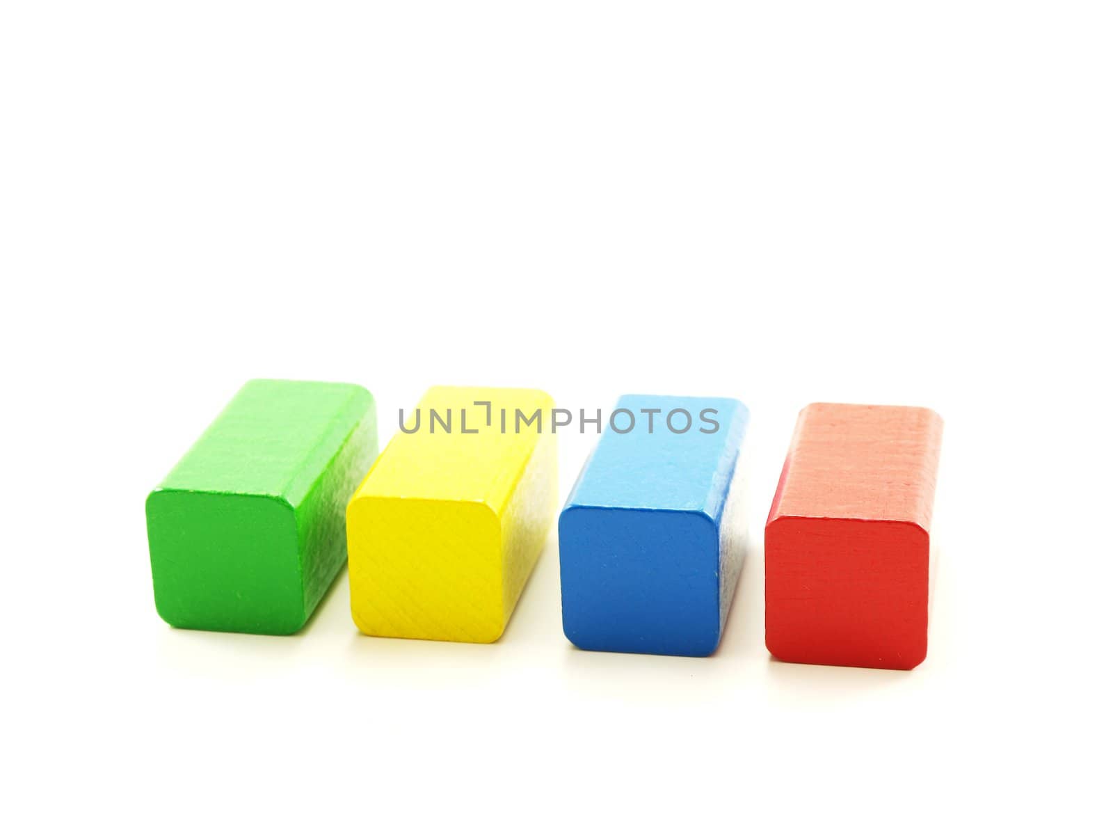 Rectangular wooden shaped pieces, assorted colors, isolated towards white