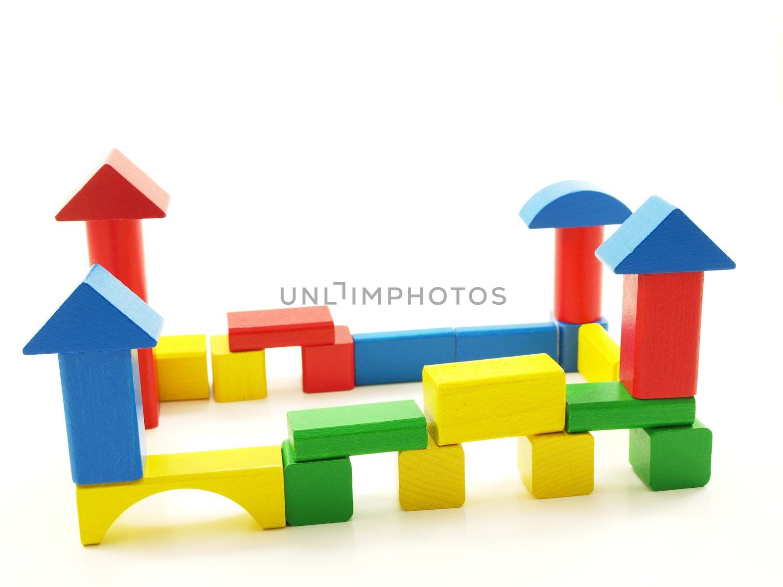 Wooden brick castle, assorted colors, isolated towards white background